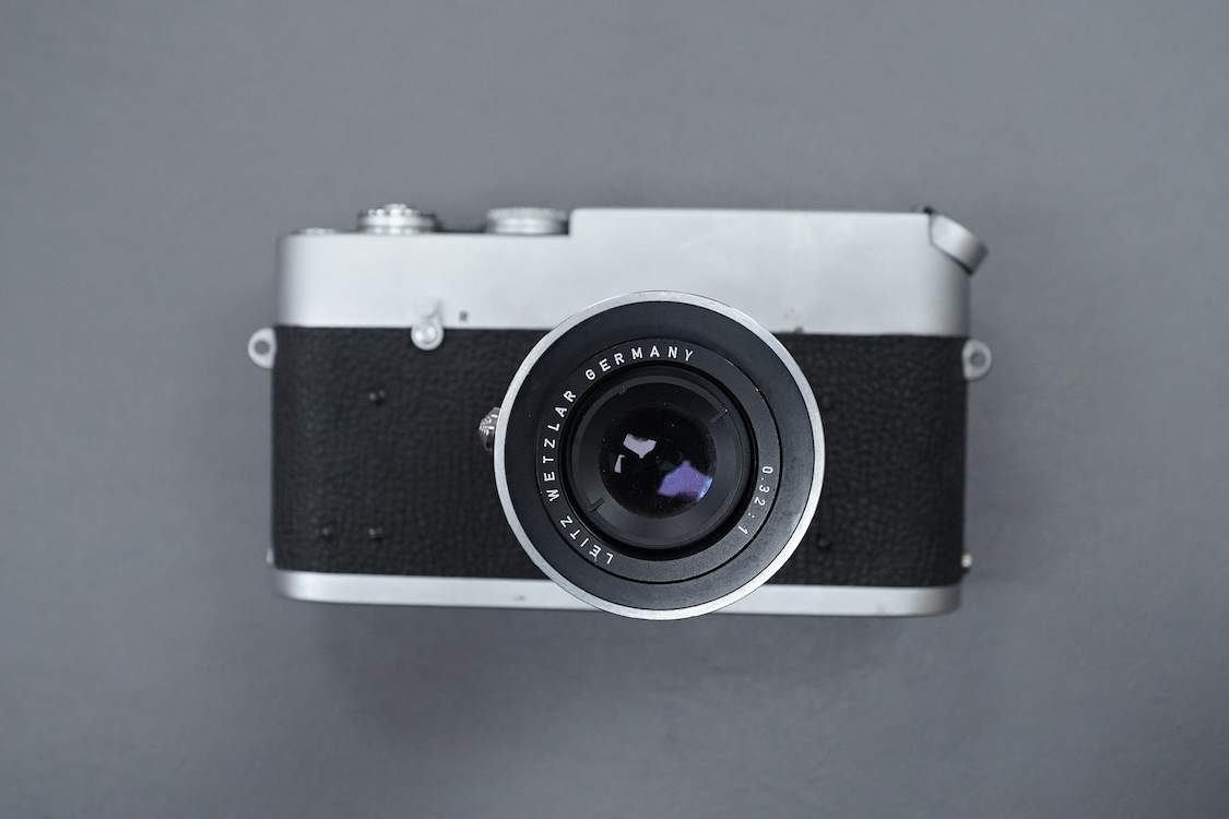 A Leica M Series MDa camera, with a Leitz 0.32:1 lens, the body stamped ‘1411519’